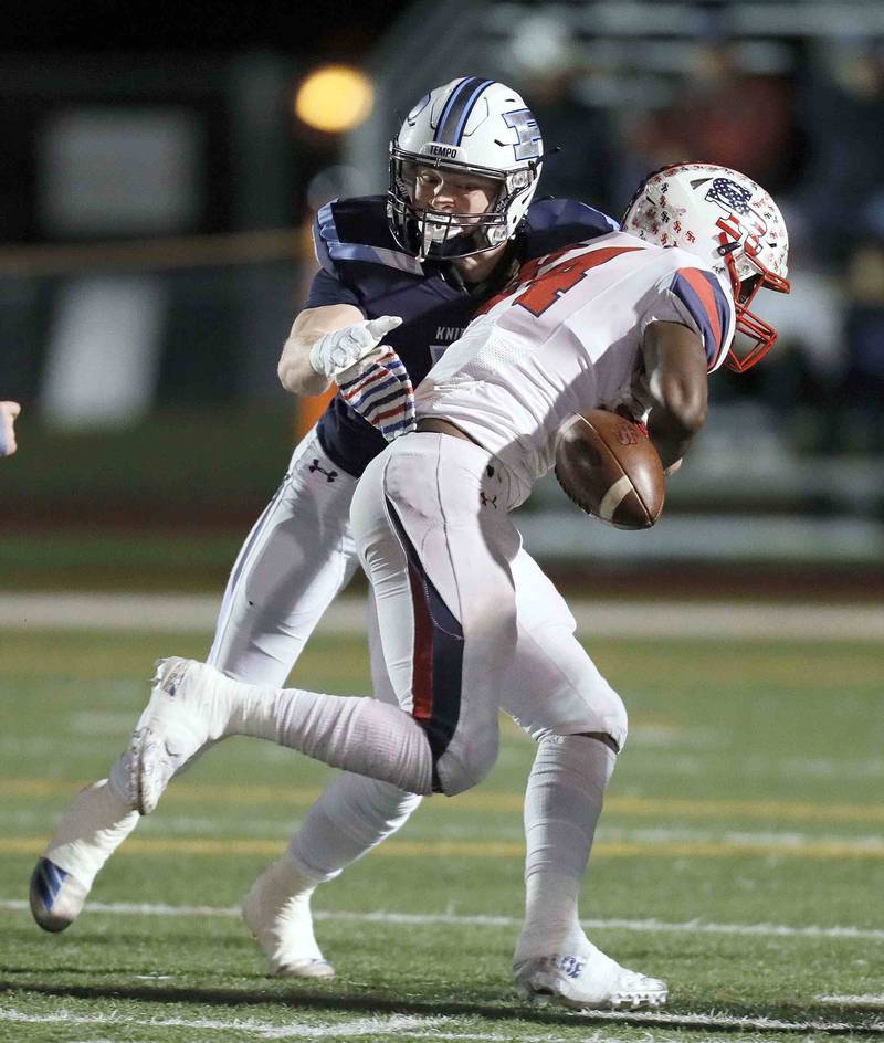 Prospect's Jack Berman (4) knocks the ball from St. Rita's Ethan Middleton (84) during the second round of the IHSA Class 7A Playoffs Friday November 4, 2022 in Mount Prospect.