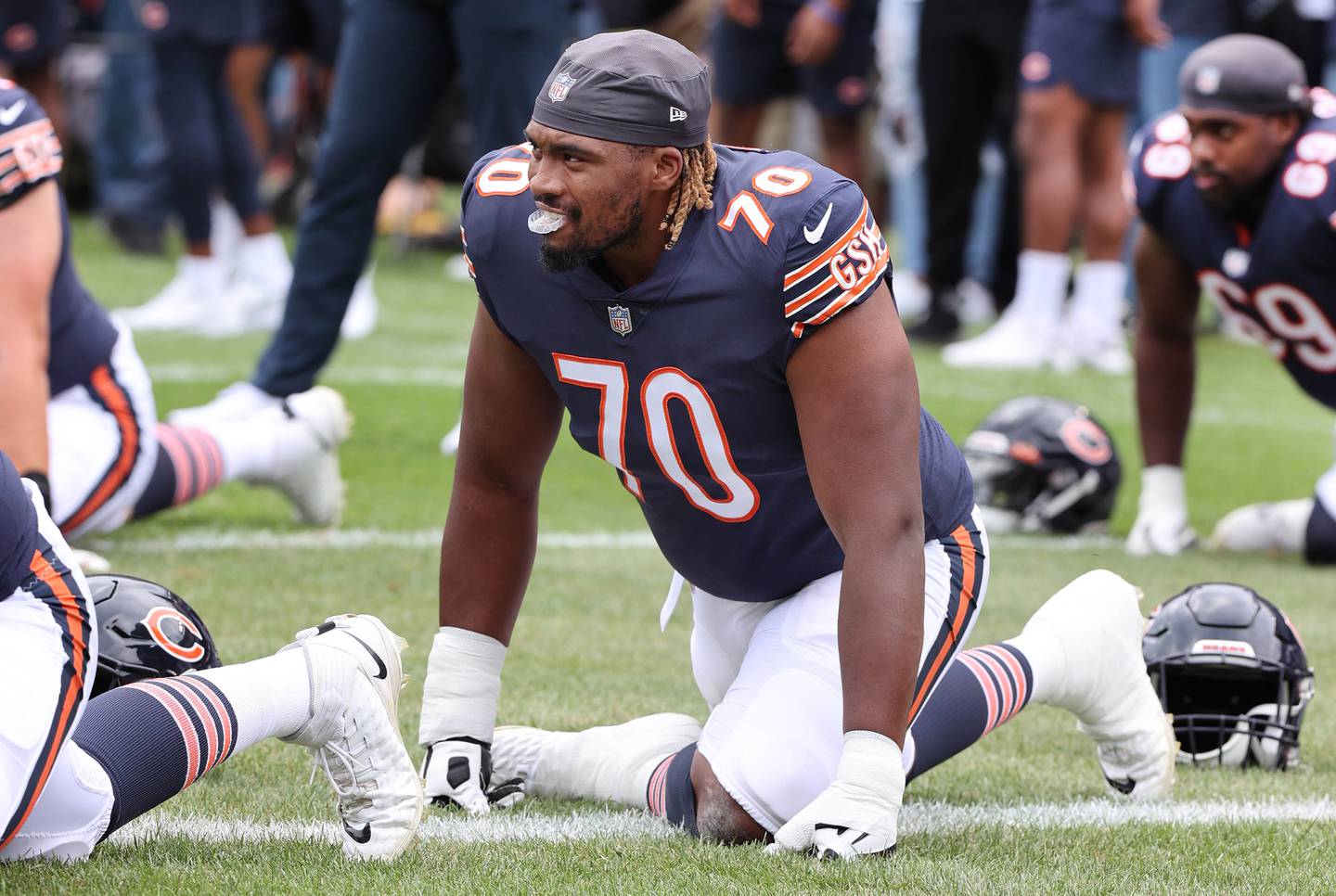 Chicago Bears offensive tackle Braxton Jones stretches before the Bears take on the Kansas City Chiefs in a 2022 game at Soldier Field in Chicago.