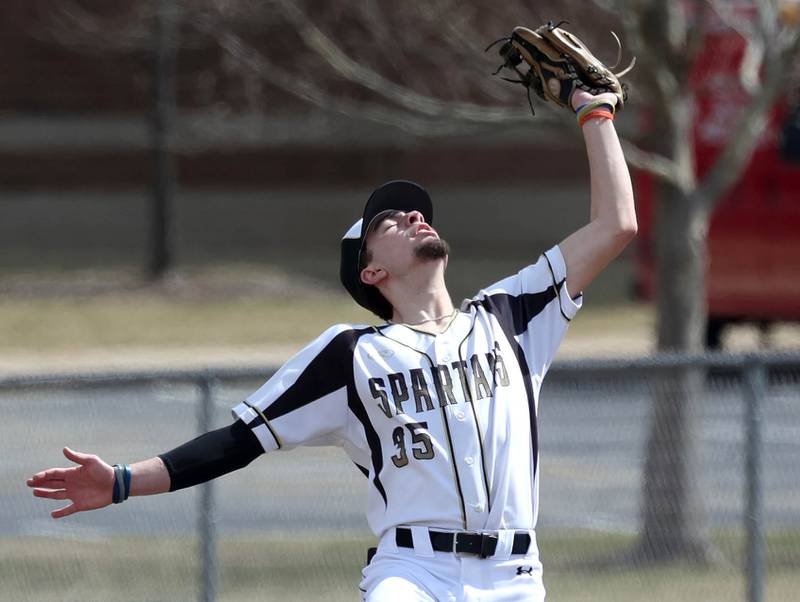Sycamore's Trenton Meisch caches a popup during their game against Byron Wednesday, March 26, 2025, at DeKalb High School. Sycamore’s home field was damaged in last week’s storms so today’s game was played on DeKalb’s field.