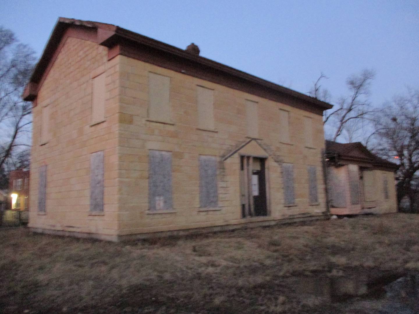 The Casseday House, seen Monday evening, has sat unused an unimproved on a city-owned lot on Jackson Street in Joliet since the 19th Century building was moved there in March 2020 to save it from demolition. March 6, 2023.