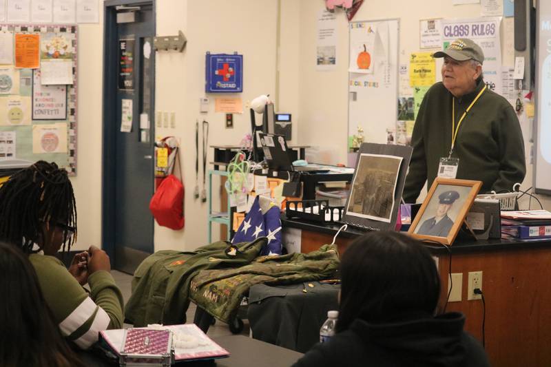Edward Higgins, a Vietnam War veteran from Rockford, gives a talk on Monday, Nov. 10, 2025, to students at Clinton Rosette Middle School in DeKalb.