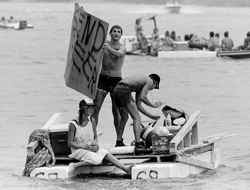 The Anything That Floats races were held from 1978-1986 each year in Peru. Contestants received a free case of Old Style beer upon entering. The rules were simple. To enter, participants needed to build a raft less than 50 feet in length and each person had to have a life jacket on board whether you wore it or not. A rope had to be attached to the raft for towing. Rafts were made from styrofoam, inter tubes or barrels. A minimum of two paddles were required on the float. Rafts were launched at the Starved Rock Boat Ramp and finished at the Peru boat launch area. Overtime, the event grew and got to big and out of control that organizers had to scrap it. This photo was found in the La Salle NewsTribune archives.