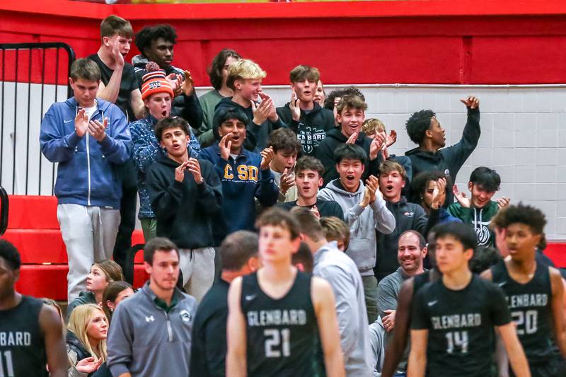 The Glenbard West student section encourages the team during their basketball game between Glenbard West at Hinsdale Central, Friday  Dec 6, 2024  in Hinsdale.