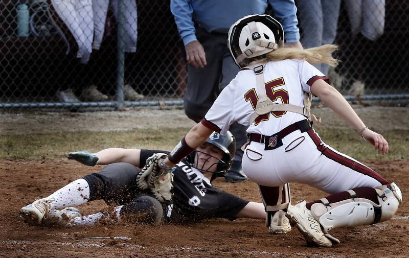 Prairie Ridge's Ady Kiddy slides into home plate as Richmond-Burton’s Rebecca Lanz tags her out during a nonconference softball game on Tuesday, March 18, 2025, at Richmond-Burton High School.