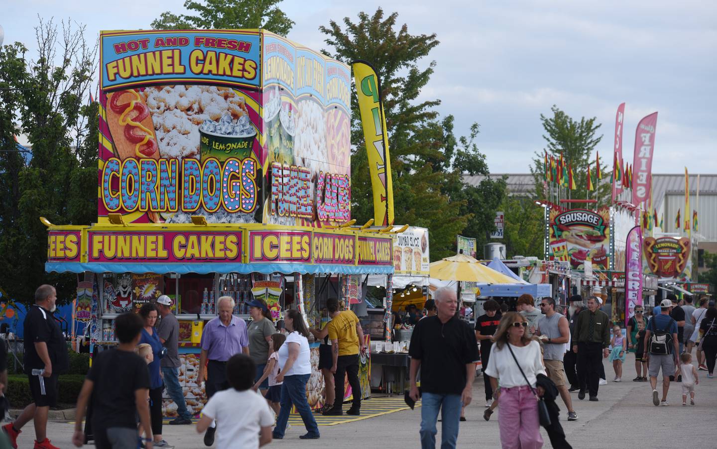 People crowd the midway during the Kane County Fair on Thursday, July 18, 2024 in St. Charles.