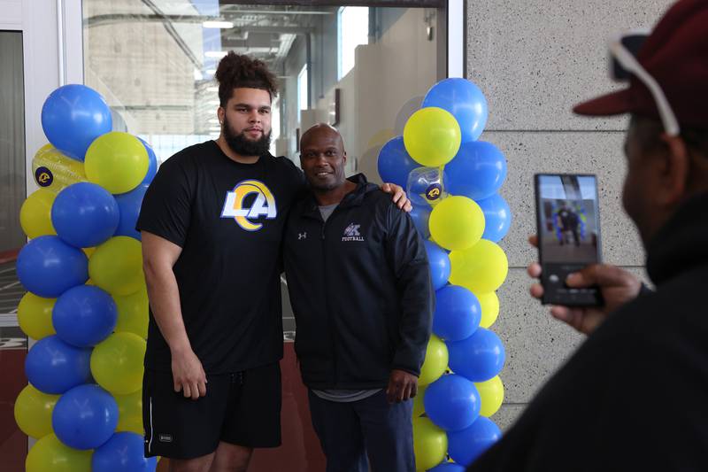 Keagen Trost, a 2019 Kankakee High School grad, poses with his former coach Omar Grant during a celebration held for him at the school on May 4, 2026, following him being drafted into the NFL to the Los Angeles Rams.