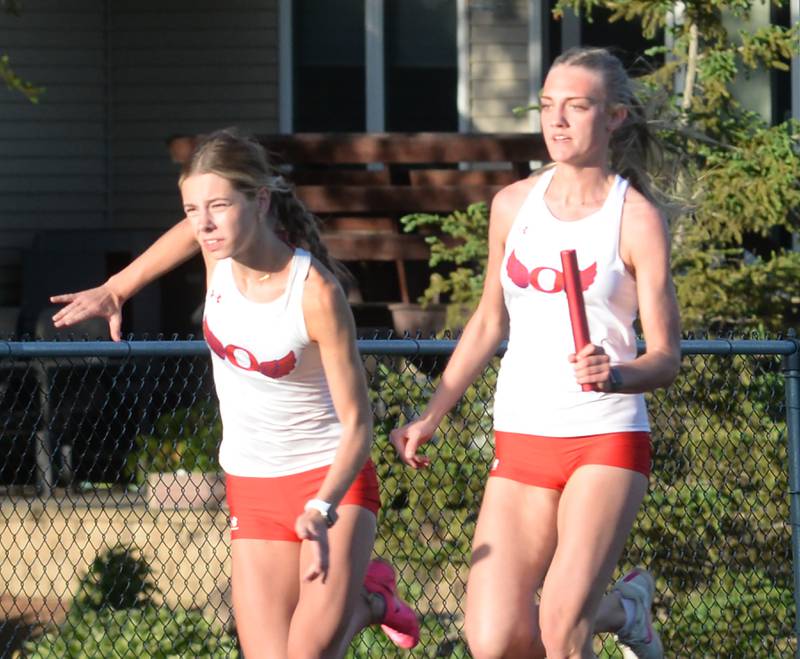 Oregon's Skylar Bishop gets ready to hand the baton to Taylor Weems in the 4x100 relay at the 1A Lena-Winslow sectional on Thursday, May 15, 2025. The Hawks finished third in this event and qualified for the state meet at Eastern Illinois University in Charleston.
