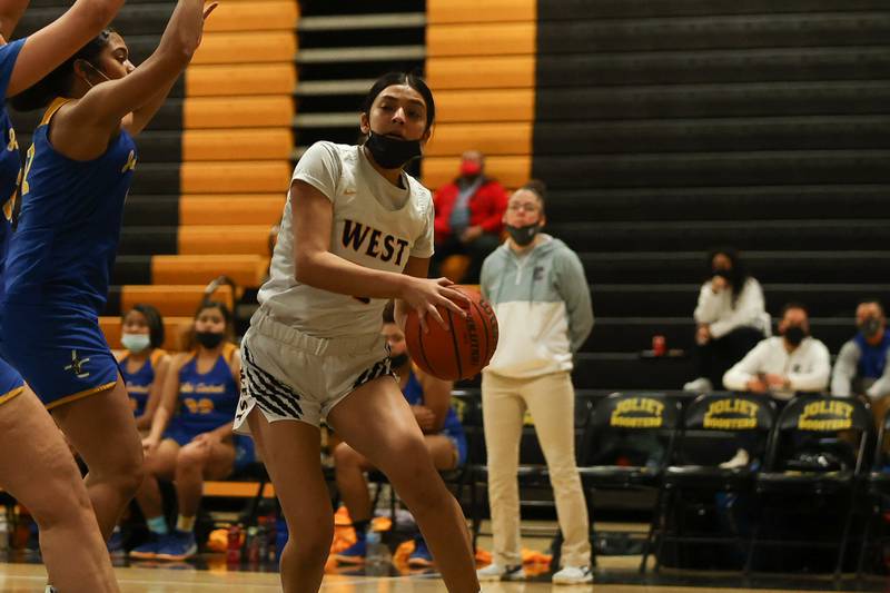 Joliet West’s Miranda Rosales looks for a play against Joliet Central. Tuesday, Feb. 8, 2022, in Joliet.