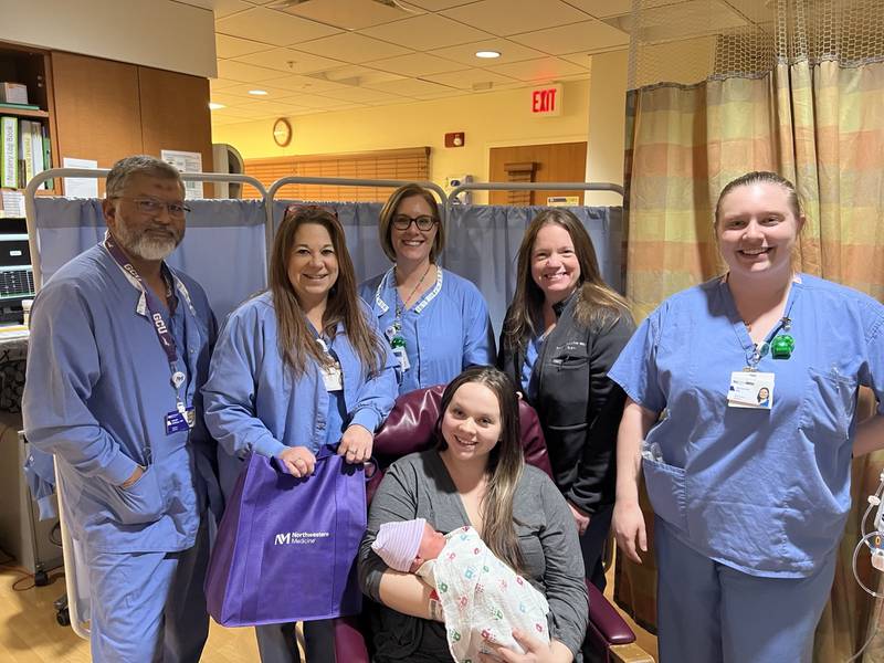 Northwestern Medicine Kishwaukee Hospital staff stand with Sophia Iversen and her newborn son Jeremiah Amiri Hernandez, who was born at 11:26 p.m. on Jan. 1, 2024.