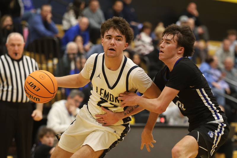 Lemont’s Zane Schneider drives along the baseline against St. Francis in the Class 3A Hinsdale South Regional semifinal game on Tuesday, March 3, 2026 in Darien.