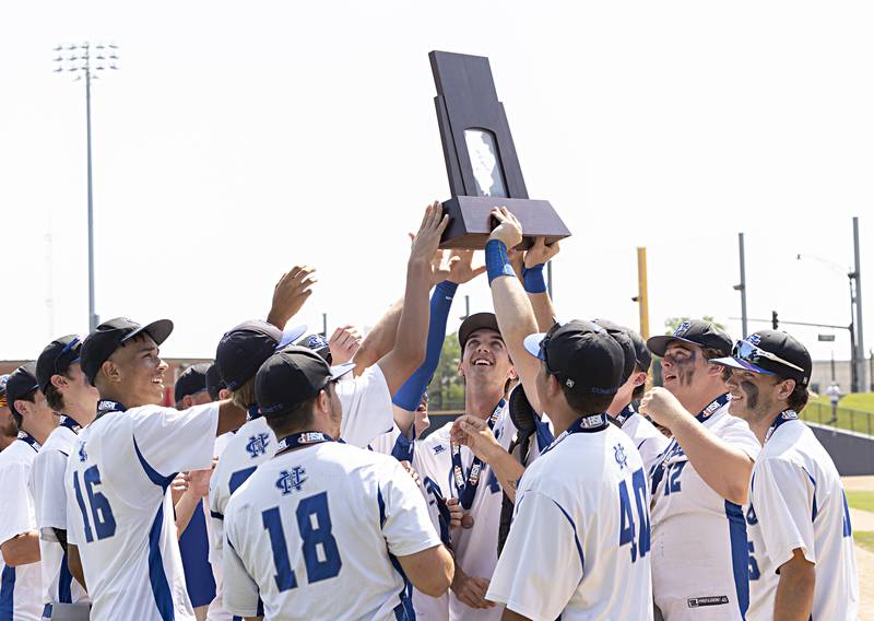 Newman hoists their third place trophy against Goreville Saturday, June 3, 2023 during the IHSA class 1A baseball game.