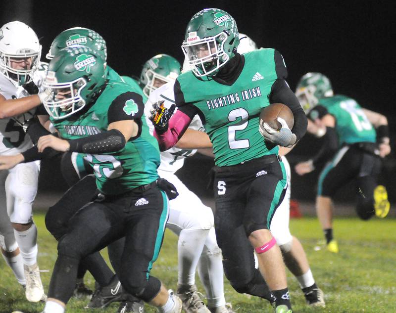 Seneca's Brayden Simek blocks for teammate Asher Hamby at home on Friday, Oct. 20, 2023.