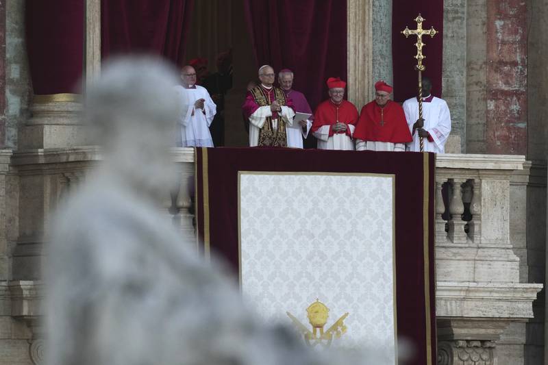 Pope Leo XIV appears on the balcony of St Peter's Basilica after his election, at the Vatican, Thursday, May 8, 2025. (AP Photo/Antonio Calanni)