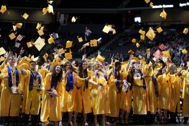 Students toss their caps at Jacobs High School graduation ceremony on May 21, 2022, at the NOW Arena in Hoffman Estates.