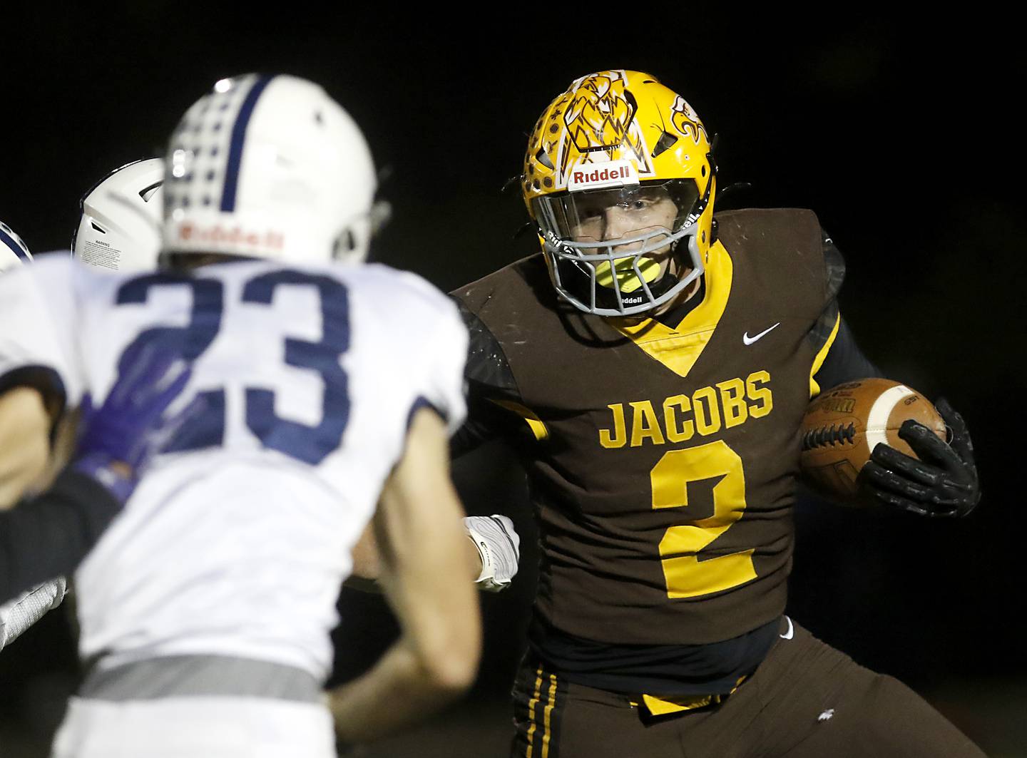 Jacobs' Caden DuMelle tries to get outside the pursuit of Cary-Grove's Lance Moore during a Fox Valley Conference football game on Friday, Oct. 24, 2025, at Jacobs High School in Algonquin.