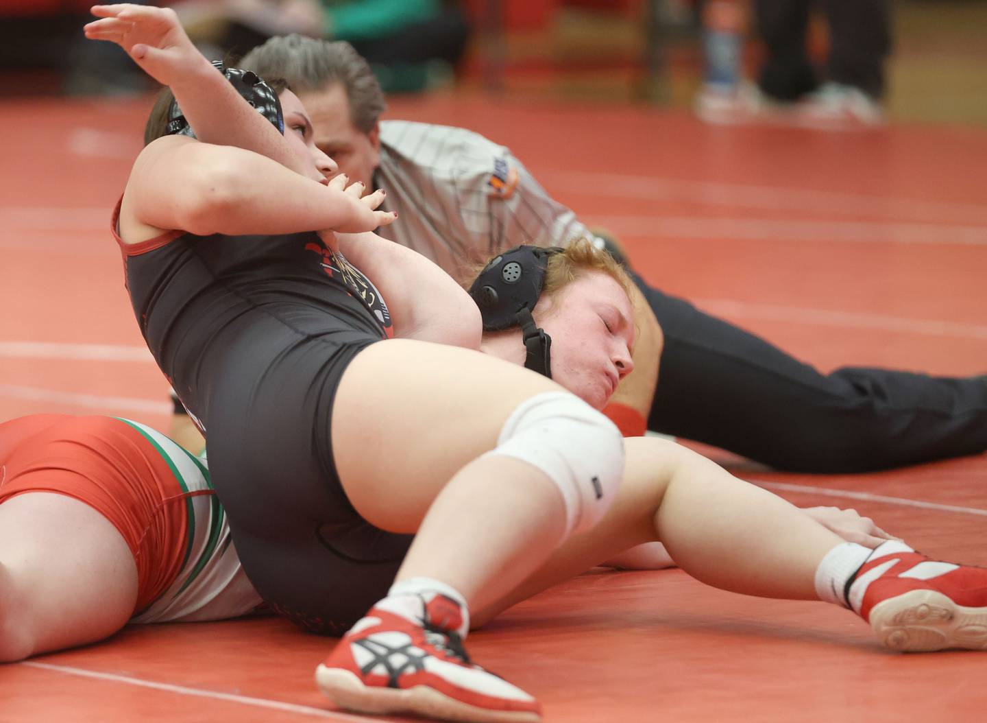 Ottawa's Dawsynn Kettman wrestels L-P's Mackenzie Miller during a meet on Thursday Jan. 8, 2026 in Kingman Gymnasium at Ottawa High School.