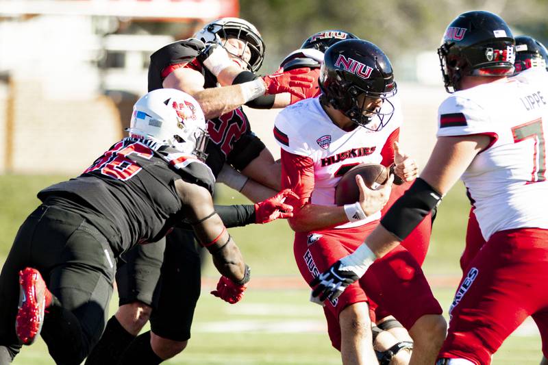 NIU quarterback Ethan Hampton is brought down against Ball State on Saturday, October 1, 2022.
