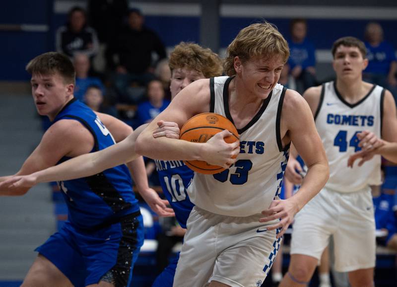 Clifton Central's Jake Thompson gets a rebound over Milford's Aiden Frerichs, back, during a Class A Regional game on Monday, Feb. 23, 2026.