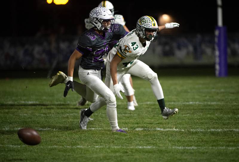 Coal City's Gaven Vestal, right, misses a pass while guarded by Wilmington's Hunter Kaitschuk, left, in a game on Friday, October 24, 2025.