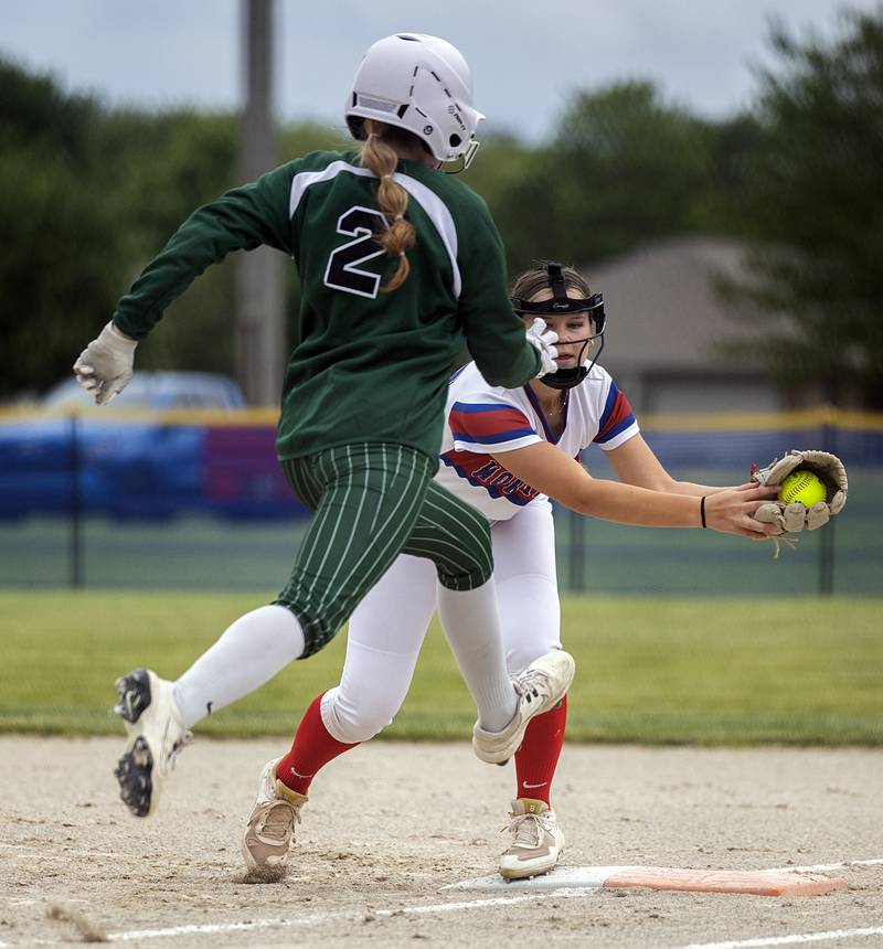 West Carroll’s Addison Sowko lunges to beat the throw at first Tuesday, May 19, 2026, at the Class 1A softball regionals at Newman.