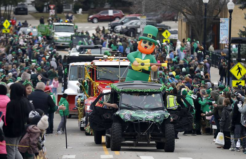 The McHenry ShamROCKS the Fox Festival Parade makes its way through the crowd on Green Street on Saturday, March 14, 2026. In McHenry. .