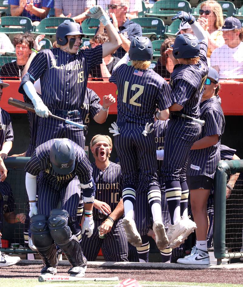 Lemont players celebrate after scoring two runs during their Class 3A state semifinal game against Highland Friday, June 7, 2024, at Duly Health and Care Field in Joliet.