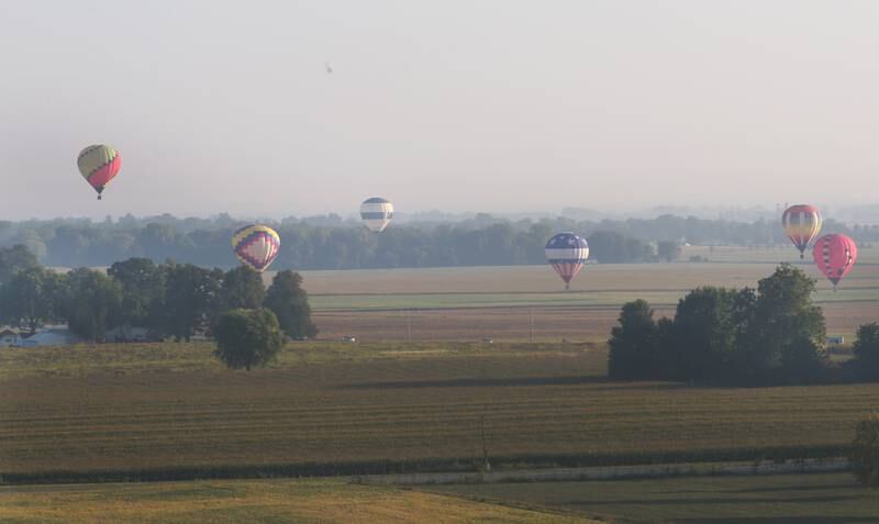 Hot air balloons fly south of Princeton during the 52nd annual Homestead Festival on Saturday, Sept. 9, 2023 in Princeton.