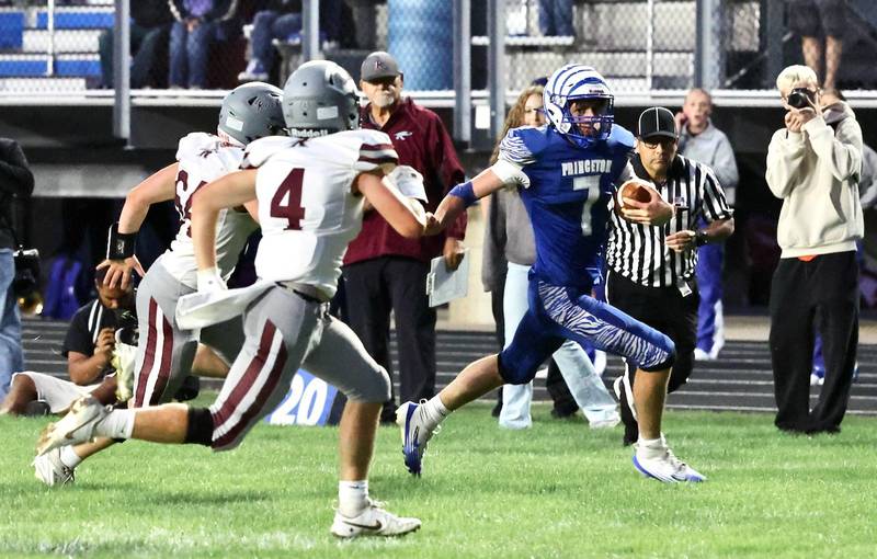 Princeton quarterback Gavin Lanham races for a 42-yard touchdown against Rockridge Friday night at Bryant Field. The Rockets won 36-29.