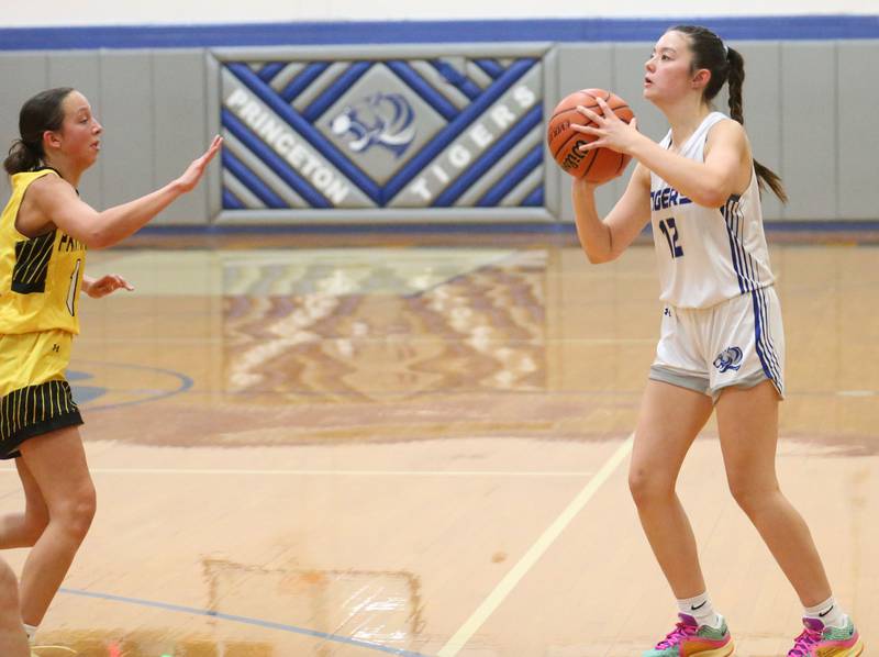 Princeton's Avaya Koning looks to shoot over Putnam County's Eme Bouxsein during the Princeton Holiday Girls Basketball Tournament on Tuesday, Nov. 19, 2024 at Princeton High School.