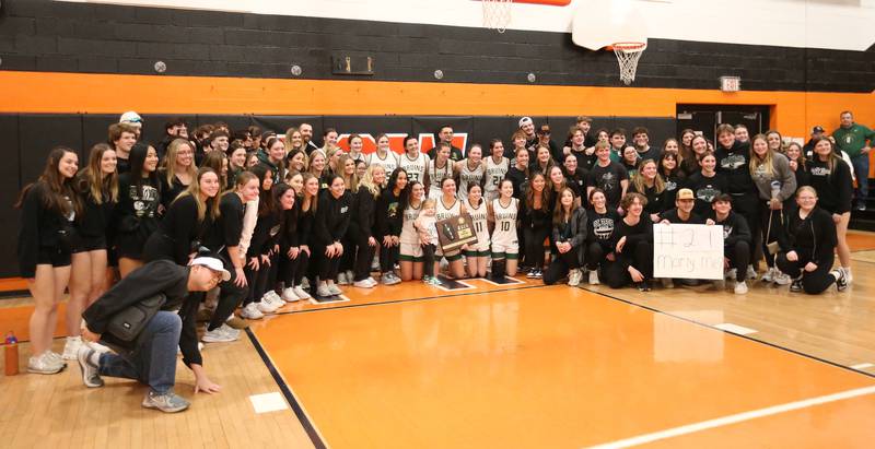 St. Bede superfans pose with the team after winning the Class 1A Sectional final game on Thursday, Feb. 22, 2024 at Gardner-South Wilmington High School.