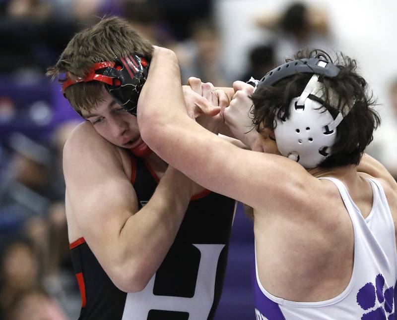 Huntley's Waylon Theobald tries to get out of the grasp of Hampshire's Aidan Rowells during the 175-pound match of a Fox Valley Conference wrestling meet on Wednesday, Jan. 8, 2025, at Hampshire High School.