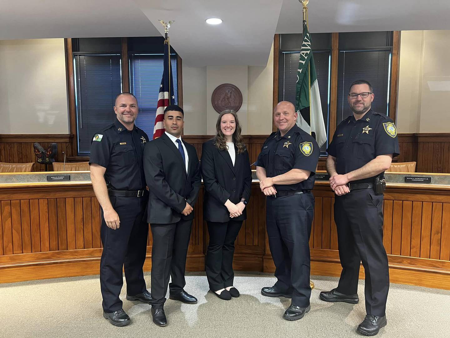 (Second from left) Steve Ramirez and (third from left) Megan Orsini were sworn in Friday, May 3, 2024, to be Ottawa police officers.