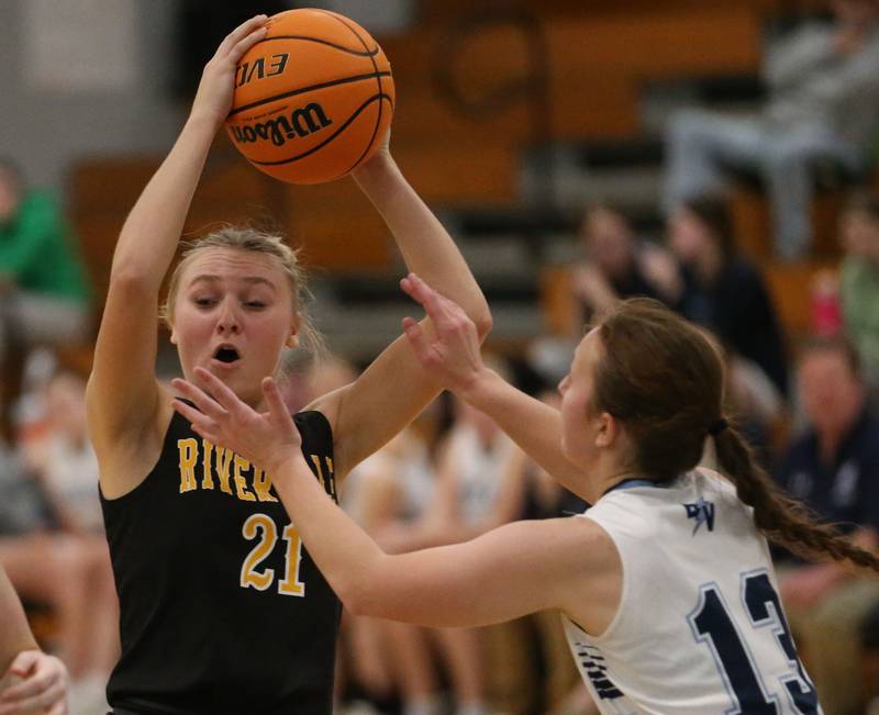 Riverdale's Cayleigh Hungate is stopped in the lane by Bureau Valley's Libby Endress during the Thanksgiving Tournament on Wednesday, Nov. 20, 2024 at Bureau Valley High School.