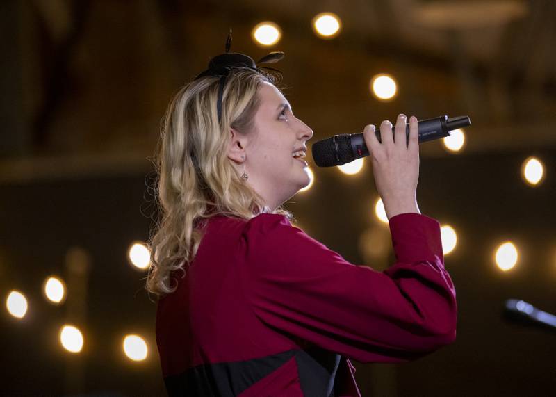 Molly Ewen of Ottawa Township High School gives a vocal performance from "Wonderland" during the Mad Hatter Ball on January 17, 2024 at the Westclox Event Center.
