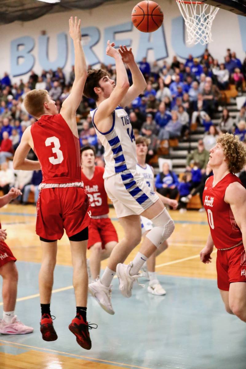 Princeton's Grady Thompson shoots against Hall's Max Bryant in Thursday's regional semifinals at the Storm Cellar. Princeton won 88-43.