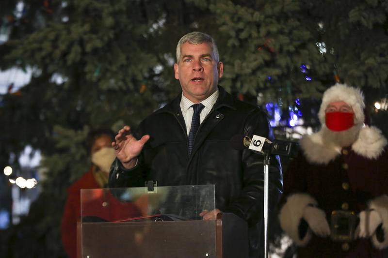 Mayor Bob O’Dekirk addresses residents watching on a Facebook Livestream, welcoming them to the virtual tree lighting on Friday, Dec. 4, 2020, at Van Buren Plaza in Joliet, Ill. Due to COVID-19 restrictions, the Joliet City Center Partnership held a virtual tree lighting ceremony in place of the annual Light Up the Holidays festival and parade.