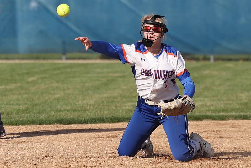 Genoa-Kingston's Emily Trzynka throws a runner out at third from her knees during their game against Stillman Valley Tuesday, April 18, 2023, at Genoa-Kingston High School.