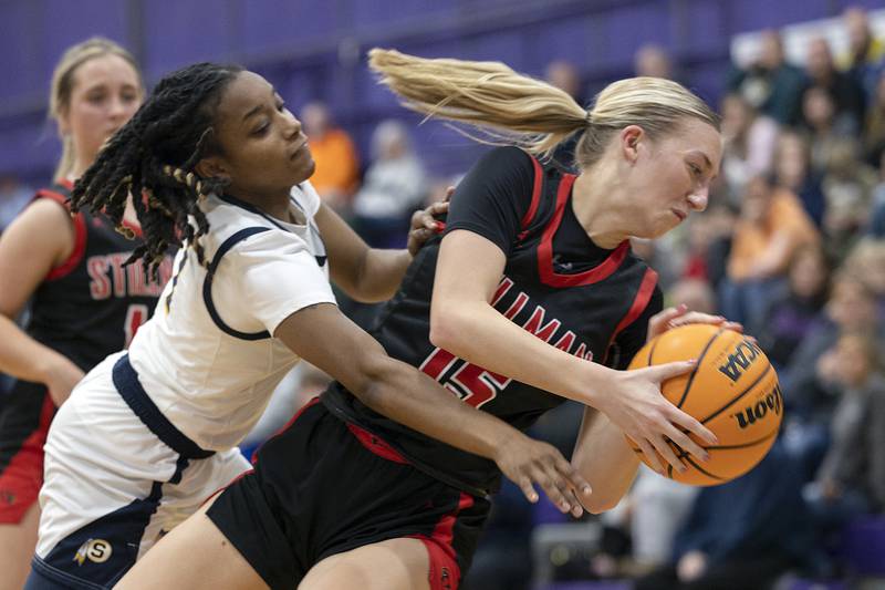 Sterling’s Taah Liberty and Stillman Valley’s Taylor Davidson fall out of bounds battling for a ball Friday, Dec. 27, 2024, during the Dixon Girls KSB Holiday Basketball Classic.