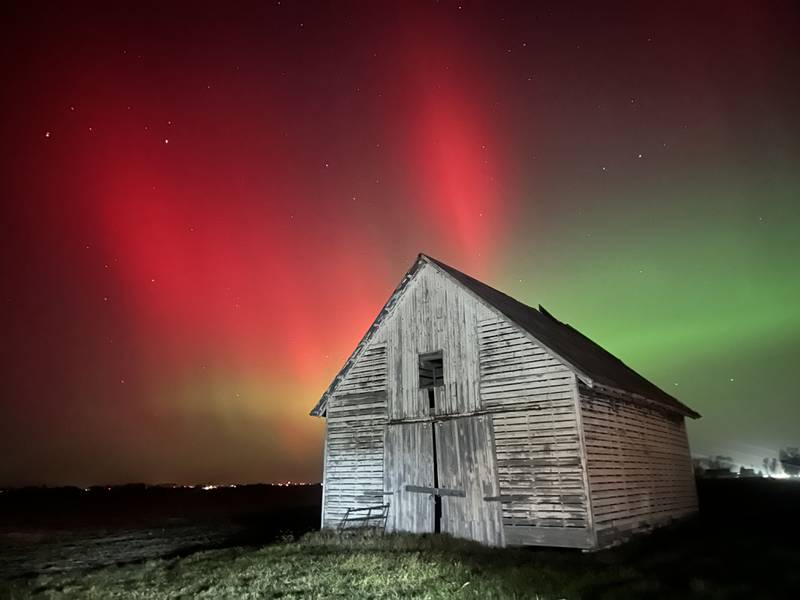 The Aurora Borealis (Northern Lights) dazzles over a barn near the intersection of Illinois Route 251 and 34th Road between Peru and Mendota on Tuesday, Nov. 11, 2025. Two coronal mass ejections (CMEs) created sparking geomagnetic storm conditions, according to the National Oceanic and Atmospheric Administration (NOAA). Space weather forecasters anticipate that geomagnetic activity may intensify to strong (G3) conditions overnight and could be around again tomorrow night.