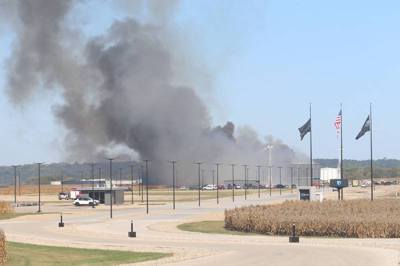 Smoke billows from Marquis Energy as firefighters work to control a structure fire on Wednesday, Oct. 8, 2025 in Hennepin. The fire was upgraded to a 5th alarm dispatching the (MABAS) Mutual Aid Box Alarm System. The fire broke out around 11a.m.