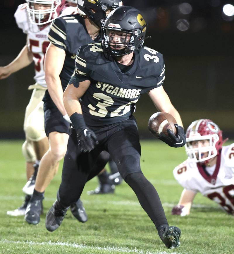 Sycamore's Joey Puleo gets through the Morris line during their game Friday, Oct. 21, 2022, at Sycamore High School.