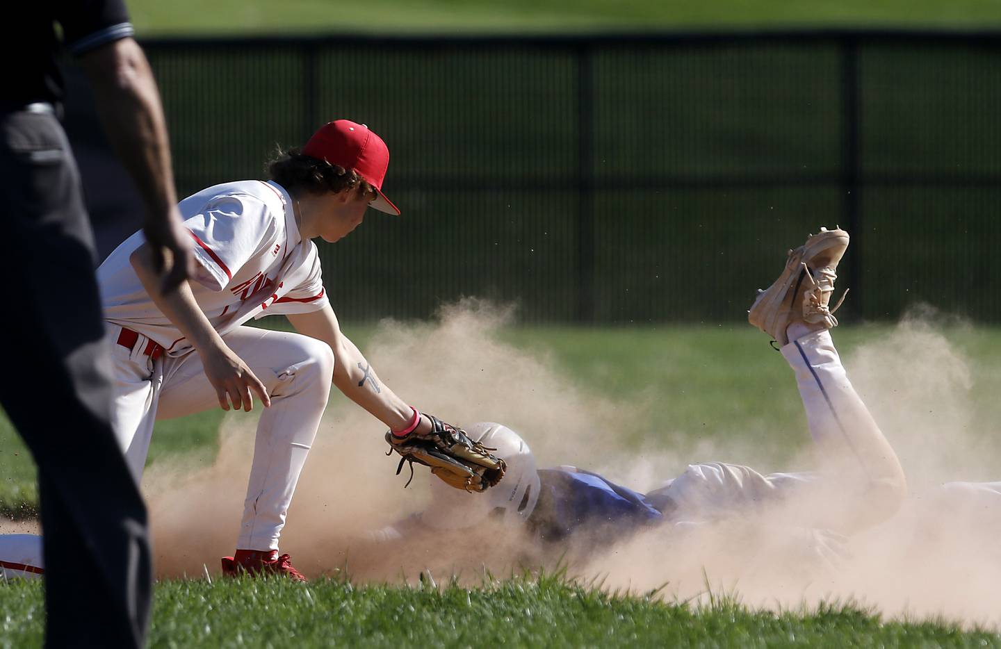 Huntley's Tyler Jakubowski tries to tag Dundee-Crown's Isaac Grzynkowicz out as he steals second base during a Fox Valley Conference baseball game on Friday, May 9, 2025, at Huntley High School.