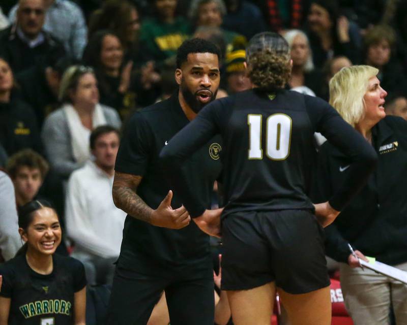 Waubonsie Valley's head coach Brett Love coaches up Danyella Mporokoso (10) during their Class 4A Bolingbrook Sectional final basketball game between Waubonsie Valley at Benet. Feb 27, 2025 in Bolingbrook.