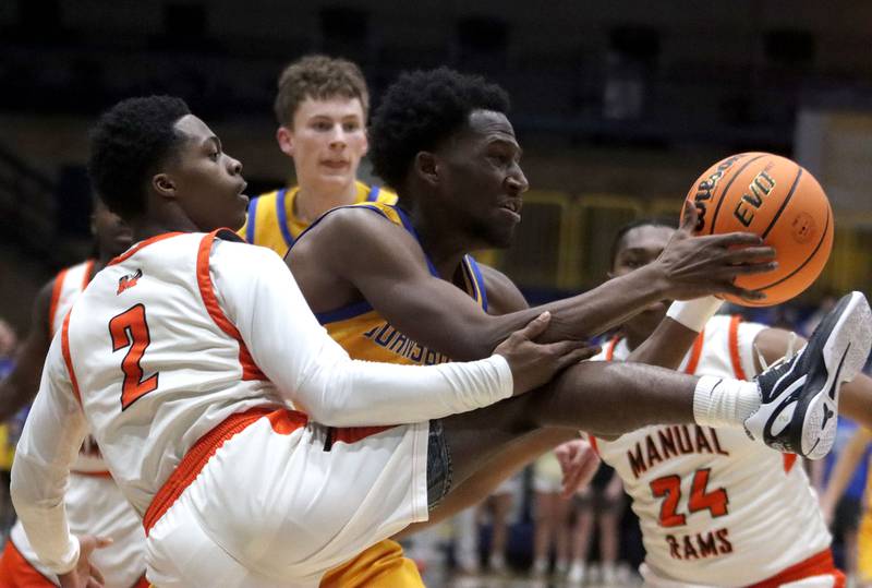 Johnsburg’s Jarrel Albea battles Peoria Manual’s Tahj Tolliver  in boys IHSA Class 2A Supersectional basketball on Monday, Mar. 9, 2026, at Sterling High School in Sterling.