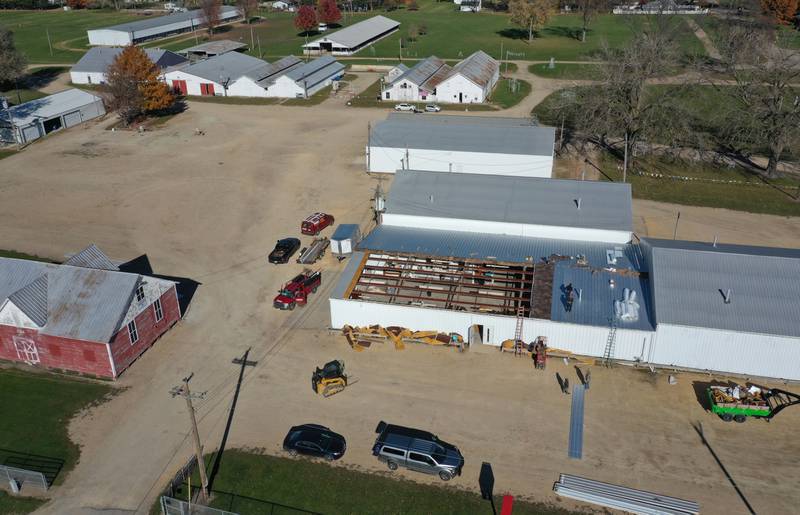 Crews from Vitale Construction work on replacing the roof of the exterior of the Exhibit Hall's 1 and 2 building on Wednesday, Nov. 8, 2023 at the Bureau County Fairgrounds in Princeton.