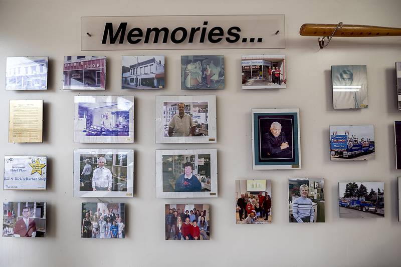 Pictures and memories hang on the wall of Bill and Dick’s Barbershop Thursday, Dec. 11, 2025, in downtown Dixon.