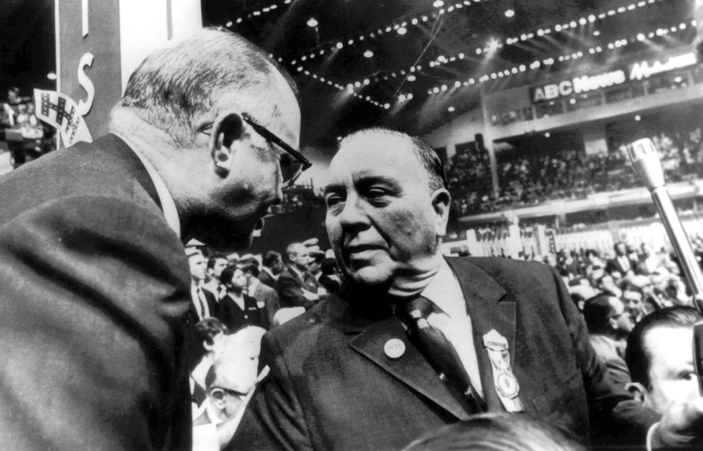 Tennessee Gov. Buford Ellington (left) bends over to chat with Chicago Mayor Richard J. Daley on the convention floor during the Democratic National Convention in Chicago on Aug. 29, 1968.