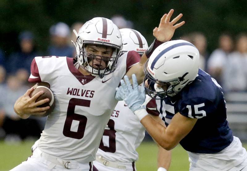 Prairie Ridge's Lukae Vanderwiel tries to avoid the tackle of Cary-Grove's Jason Ritter Jr. during a Fox Valley Conference football game on Friday, Aug. 29, 2025, at Cary-Grove High School in Cary.