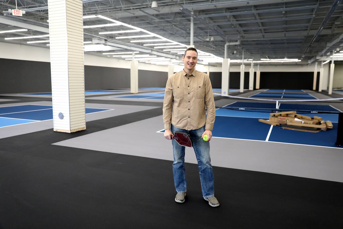 Owner Nathan Taylor stands inside Pickled, an indoor pickleball facility at 301 N. Randall Rd. in Batavia. Taylor hopes the facility opens in mid-December.