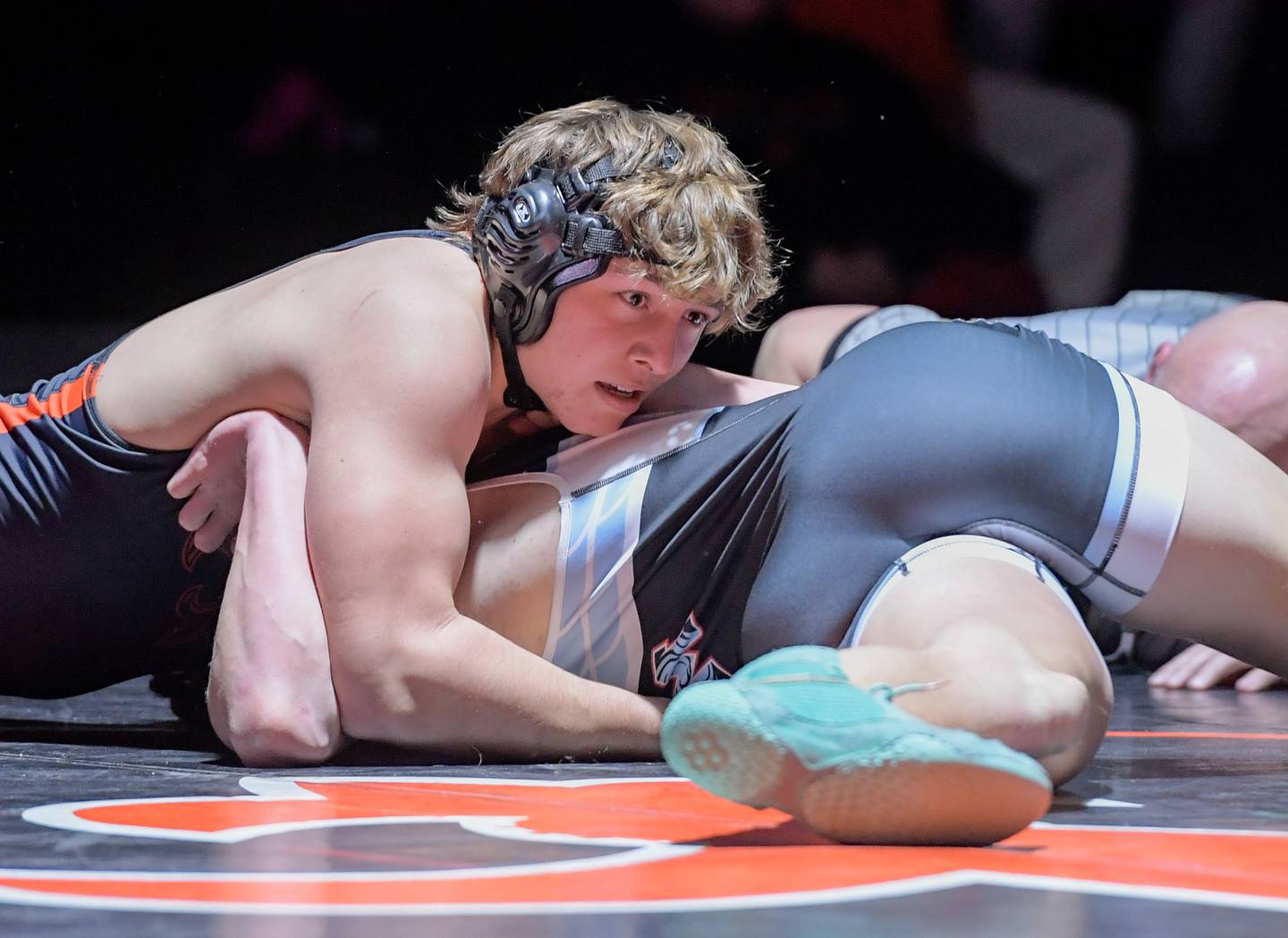 St. Charles East’s Cooper Murray and Marian Central’s Dan French wrestle at 190 pounds during a match in St. Charles on Wednesday, December 20, 2023.